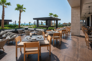 Outdoor terrace dining area at Matsuhisa Restaurant at AMARA Hotel Limassol during a bright Mediterranean afternoon.